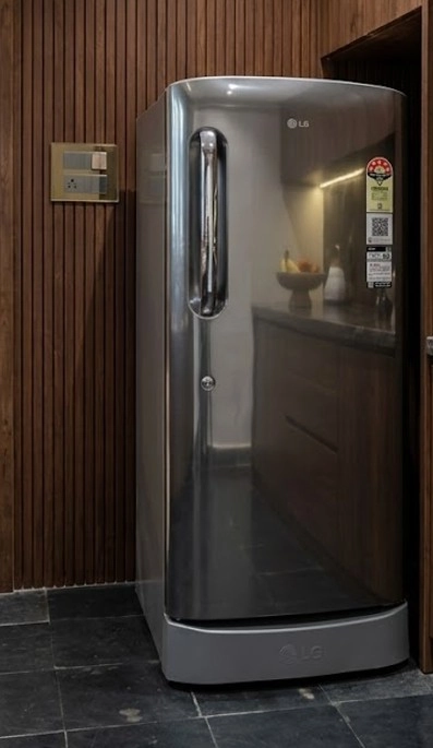 Modern LG refrigerator in the guest kitchen of the Riverside Retreat serviced villa in Thiruvalla.